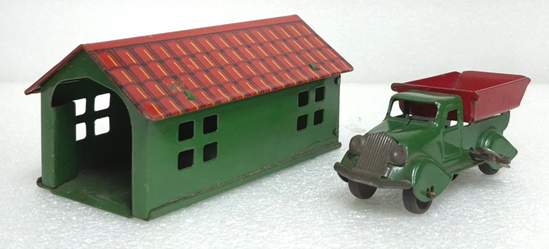 1930's Marx Pressed Steel Wind-Up Dump Truck and Tin Litho Garage 1